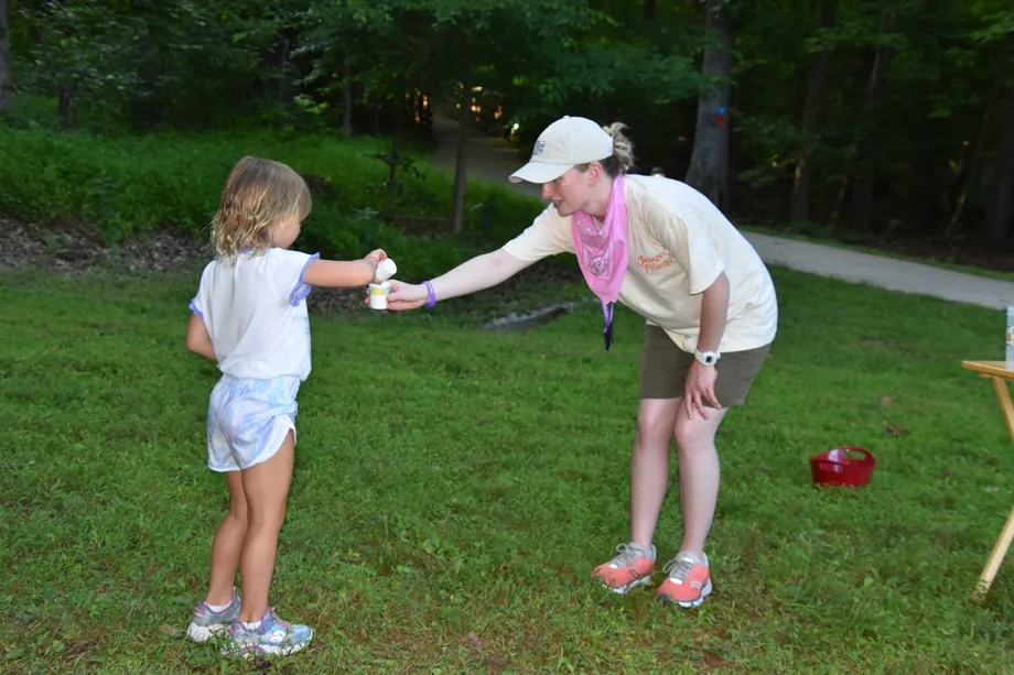 Campers and counselors together during a group activity at camp